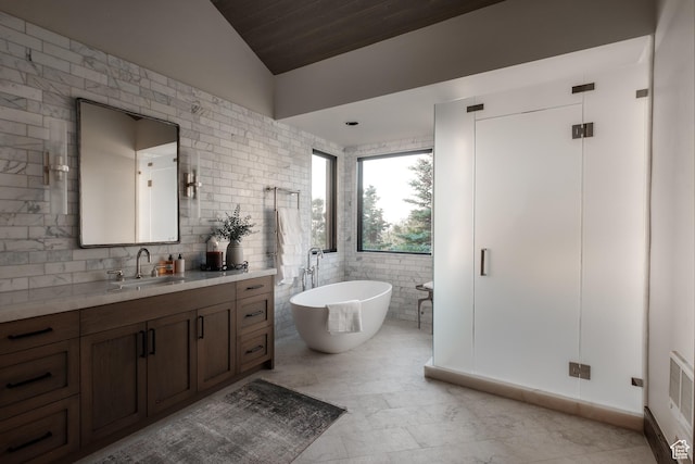 9156 E Forest Rd Unit 24, Heber City, UT 84032 - full bathroom with vanity, a freestanding tub, vaulted ceiling, tile walls, and wood ceiling
