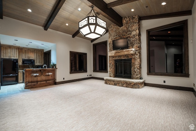 9156 E Forest Rd Unit 24, Heber City, UT 84032 - unfurnished living room with light carpet, a stone fireplace, recessed lighting, and wooden ceiling
