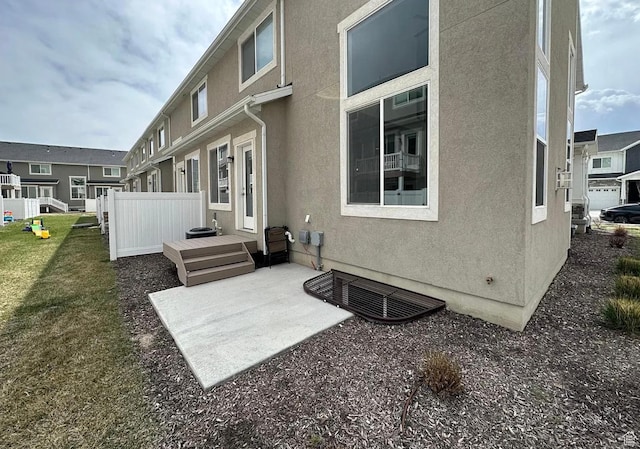 1738 W Terra Vis, Saratoga Springs, UT 84045 - rear view of property featuring stucco siding and a patio