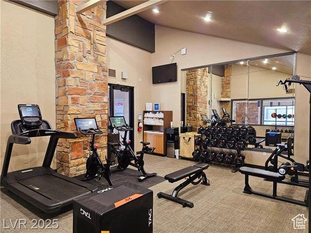 223 Hunter Ridge Rd Unit E121, Brian Head, UT 84719 - exercise room with carpet flooring, high vaulted ceiling, and recessed lighting