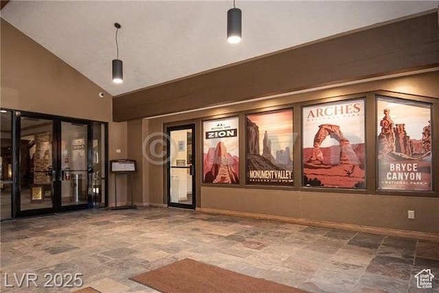 223 Hunter Ridge Rd Unit E121, Brian Head, UT 84719 - cinema room with stone finish floors, french doors, and a high ceiling