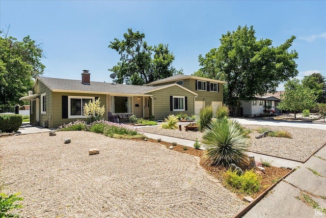 1680 E Fieldcrest Ln, Holladay, UT 84117 - view of front of home featuring a garage, a chimney, and concrete driveway