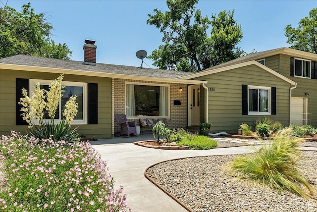 1680 E Fieldcrest Ln, Holladay, UT 84117 - view of front of property with a chimney