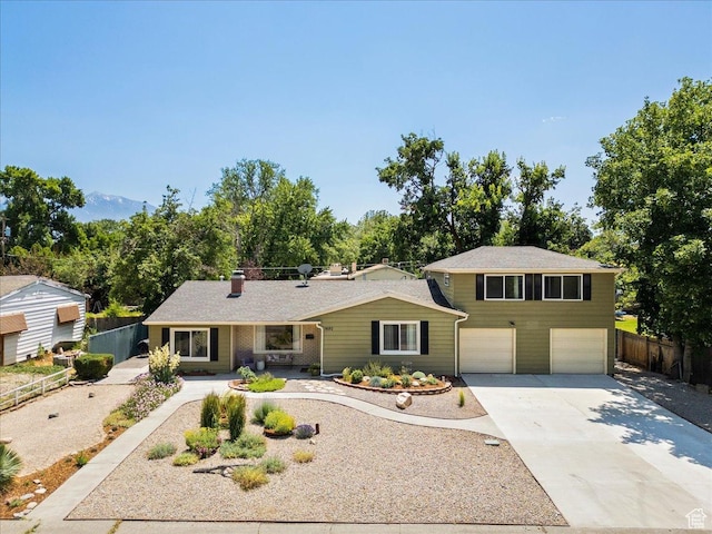 1680 E Fieldcrest Ln, Holladay, UT 84117 - view of front of property with a garage and concrete driveway