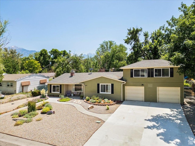 1680 E Fieldcrest Ln, Holladay, UT 84117 - view of front of home with driveway and an attached garage