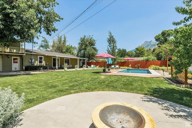 1680 E Fieldcrest Ln, Holladay, UT 84117 - fenced backyard featuring a patio area and a mountain view