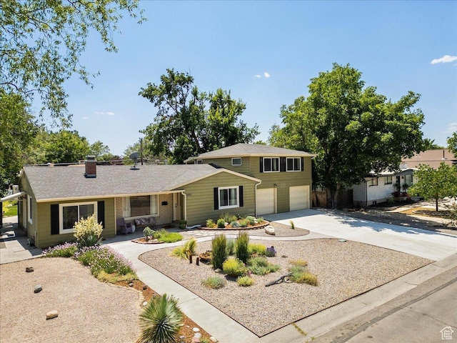 1680 E Fieldcrest Ln, Holladay, UT 84117 - view of front of home with an attached garage, driveway, and a chimney