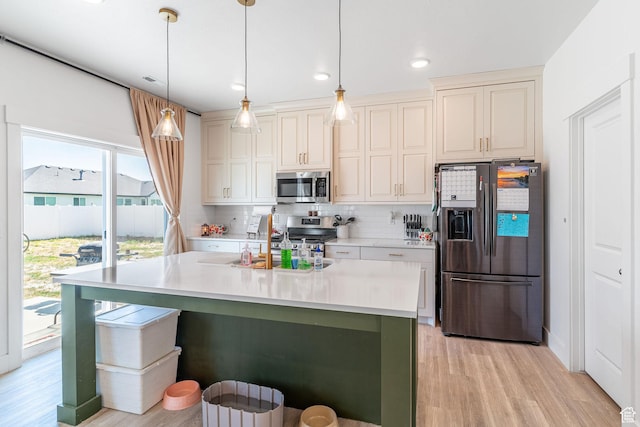 2477 W 2900 N, Farr West, UT 84404 - kitchen featuring stainless steel appliances, light wood-style floors, tasteful backsplash, light countertops, and recessed lighting