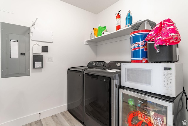2477 W 2900 N, Farr West, UT 84404 - washroom with electric panel, separate washer and dryer, light wood-style floors, and wine cooler