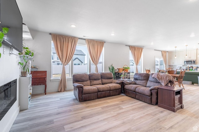 2477 W 2900 N, Farr West, UT 84404 - living room featuring light wood-style flooring and recessed lighting