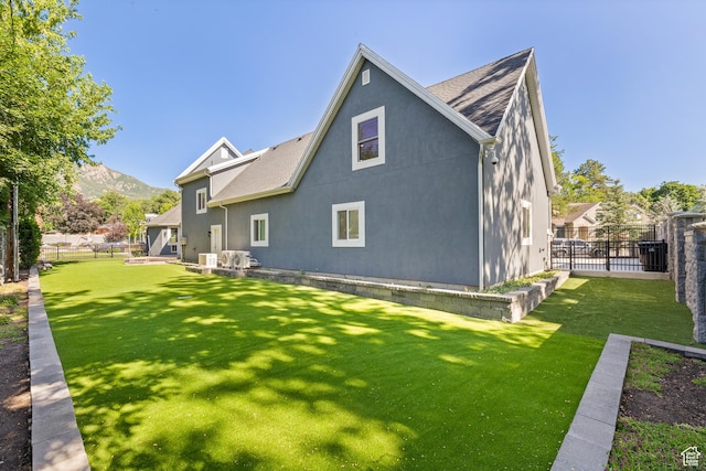 6273 S Oakcrest Cir, Holladay, UT 84121 - back of house featuring stucco siding, a mountain view, and a shingled roof