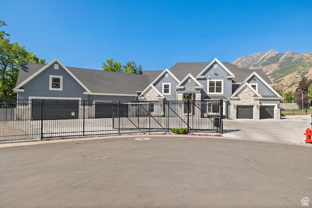 6273 S Oakcrest Cir, Holladay, UT 84121 - view of front of home with stone siding, driveway, a mountain view, and an attached garage