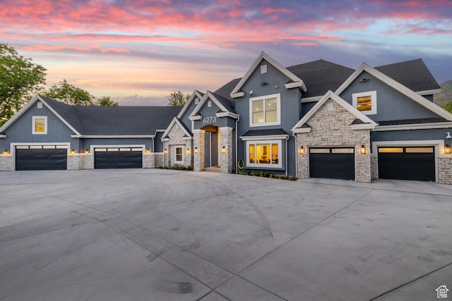 6273 S Oakcrest Cir, Holladay, UT 84121 - craftsman-style home featuring stone siding, concrete driveway, stucco siding, a shingled roof, and a garage