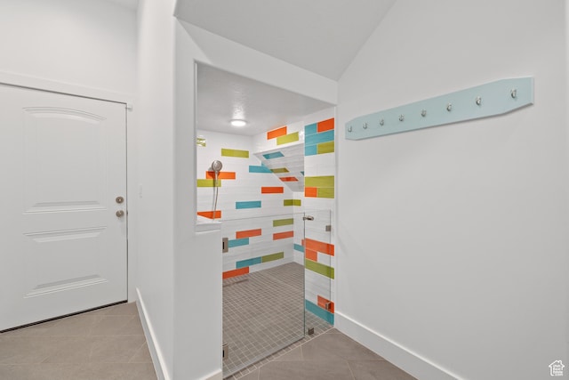 6273 S Oakcrest Cir, Holladay, UT 84121 - full bath with tile patterned floors, a shower stall, and lofted ceiling