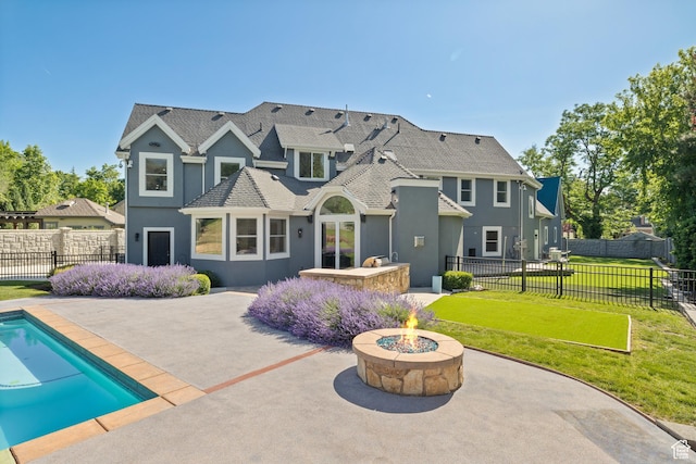 6273 S Oakcrest Cir, Holladay, UT 84121 - rear view of property featuring a patio area, stucco siding, an outdoor fire pit, and roof with shingles