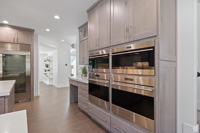 6273 S Oakcrest Cir, Holladay, UT 84121 - kitchen featuring stainless steel appliances, light countertops, gray cabinetry, recessed lighting, and wood finished floors