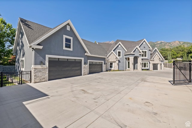 6273 S Oakcrest Cir, Holladay, UT 84121 - view of front of property featuring stone siding, driveway, stucco siding, a shingled roof, and an attached garage