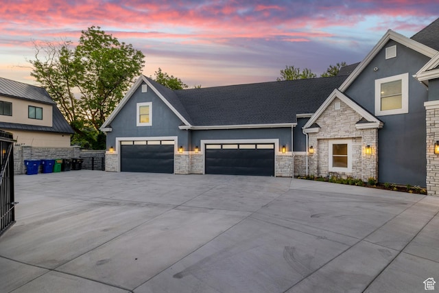 6273 S Oakcrest Cir, Holladay, UT 84121 - view of front facade with stone siding, stucco siding, driveway, an attached garage, and roof with shingles