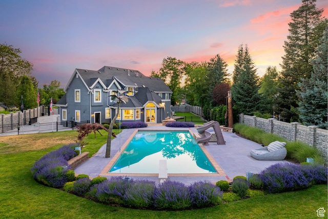 6273 S Oakcrest Cir, Holladay, UT 84121 - view of swimming pool featuring a water slide, a fenced backyard, a patio, and a diving board
