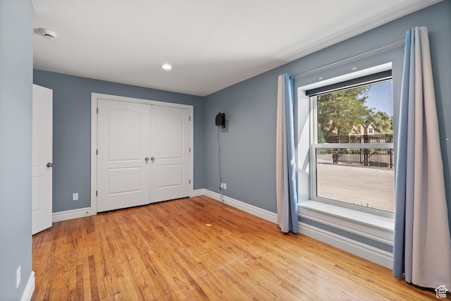 6273 S Oakcrest Cir, Holladay, UT 84121 - unfurnished bedroom featuring wood finished floors, recessed lighting, and a closet