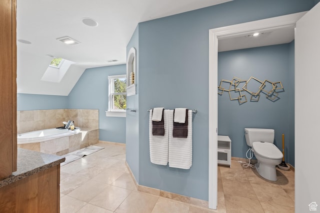 6273 S Oakcrest Cir, Holladay, UT 84121 - bathroom with a skylight, a garden tub, lofted ceiling, and tile patterned floors