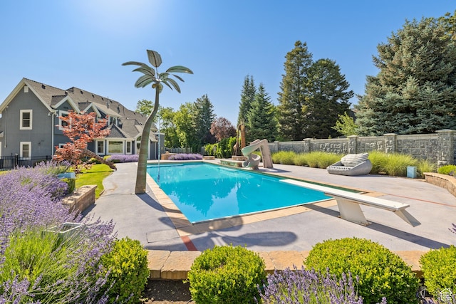 6273 S Oakcrest Cir, Holladay, UT 84121 - view of pool with a patio area, a water slide, and a diving board