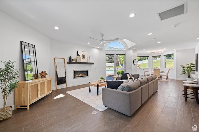 6273 S Oakcrest Cir, Holladay, UT 84121 - living room featuring recessed lighting, ceiling fan, a glass covered fireplace, and dark wood finished floors