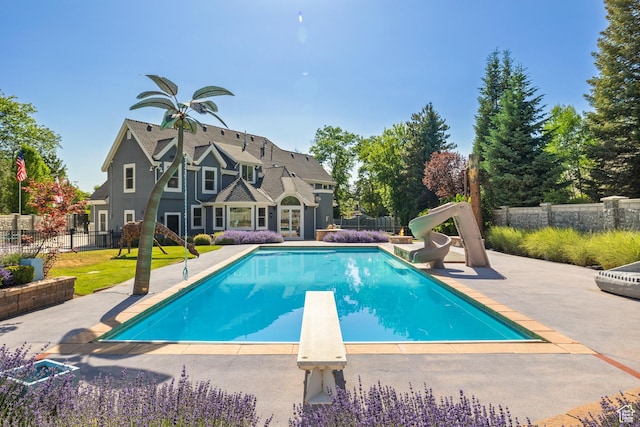6273 S Oakcrest Cir, Holladay, UT 84121 - view of pool featuring a water slide, a patio area, and a diving board