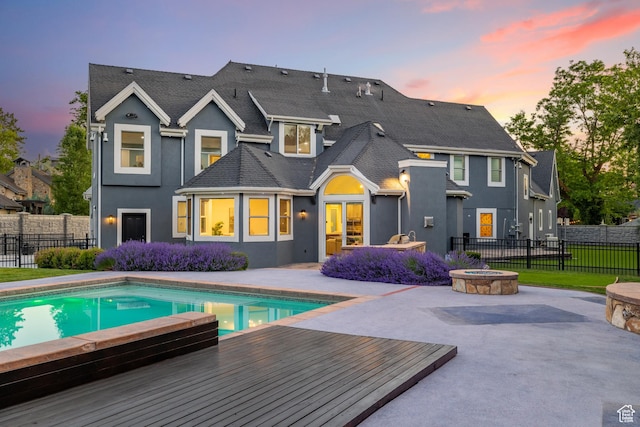 6273 S Oakcrest Cir, Holladay, UT 84121 - rear view of property featuring an outdoor fire pit, stucco siding, and a patio