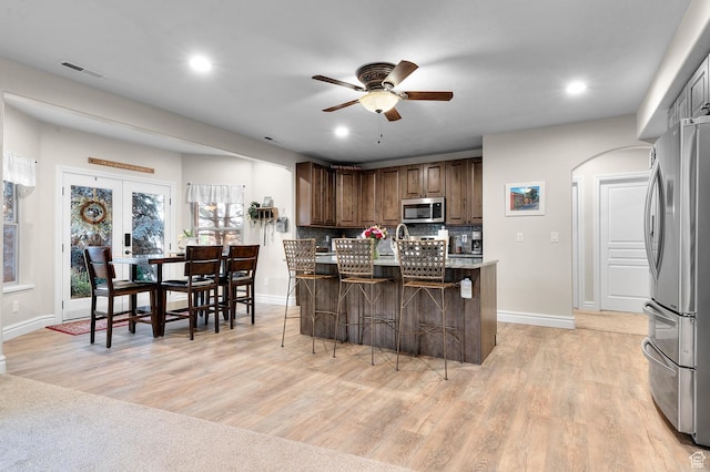 1524 E 330 N, Lehi, UT 84043 - kitchen featuring stainless steel appliances, a ceiling fan, a kitchen bar, light wood finished floors, and recessed lighting