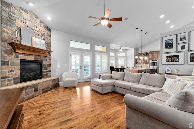 1524 E 330 N, Lehi, UT 84043 - living area with a ceiling fan, a fireplace, light wood-style flooring, high vaulted ceiling, and recessed lighting