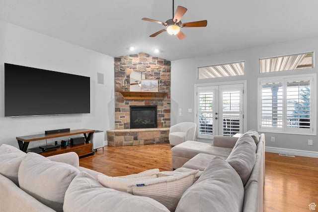 1524 E 330 N, Lehi, UT 84043 - living room featuring a ceiling fan, lofted ceiling, wood finished floors, and a stone fireplace