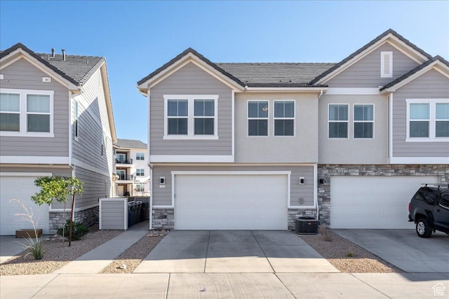 6029 S Carnelian Pkwy, St George, UT 84790 - view of front of house featuring stone siding, a garage, and driveway