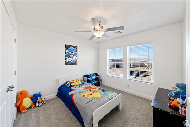 6029 S Carnelian Pkwy, St George, UT 84790 - carpeted bedroom with baseboards and a ceiling fan