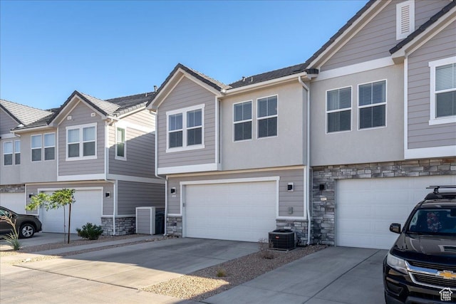 6029 S Carnelian Pkwy, St George, UT 84790 - view of property with stone siding, a garage, and concrete driveway