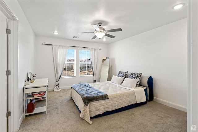 6029 S Carnelian Pkwy, St George, UT 84790 - bedroom with light colored carpet, a ceiling fan, and recessed lighting