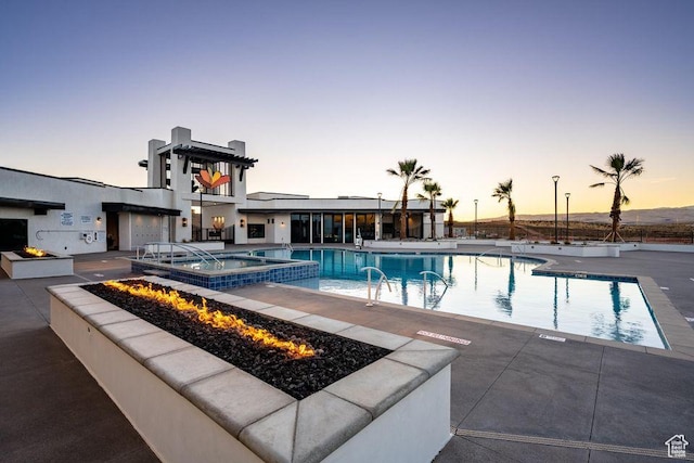 6029 S Carnelian Pkwy, St George, UT 84790 - community pool featuring an outdoor fire pit and a patio area