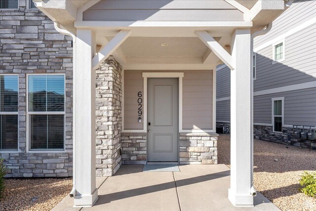 6029 S Carnelian Pkwy, St George, UT 84790 - view of exterior entry with stone siding and a porch