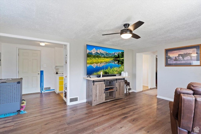 1975 N 2000 W, Farr West, UT 84404 - living area with ceiling fan, a textured ceiling, and wood finished floors