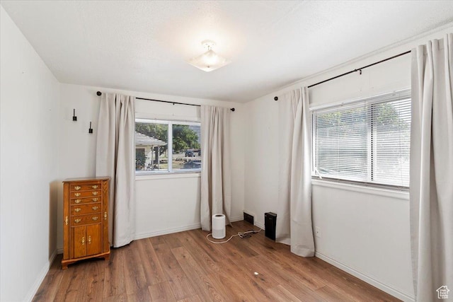 1975 N 2000 W, Farr West, UT 84404 - unfurnished bedroom with light wood-style flooring