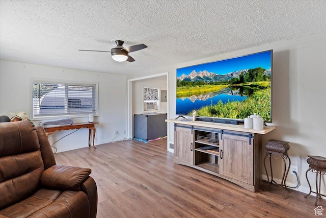 1975 N 2000 W, Farr West, UT 84404 - living room featuring ceiling fan, wood finished floors, a textured ceiling, and cooling unit