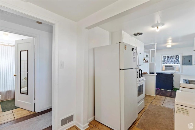 1975 N 2000 W, Farr West, UT 84404 - kitchen featuring white appliances, electric panel, cooling unit, and light tile patterned floors