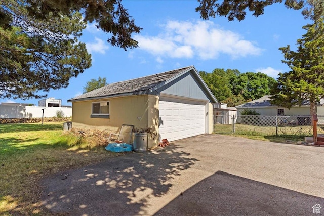1975 N 2000 W, Farr West, UT 84404 - view of side of home featuring a detached garage and an outdoor structure