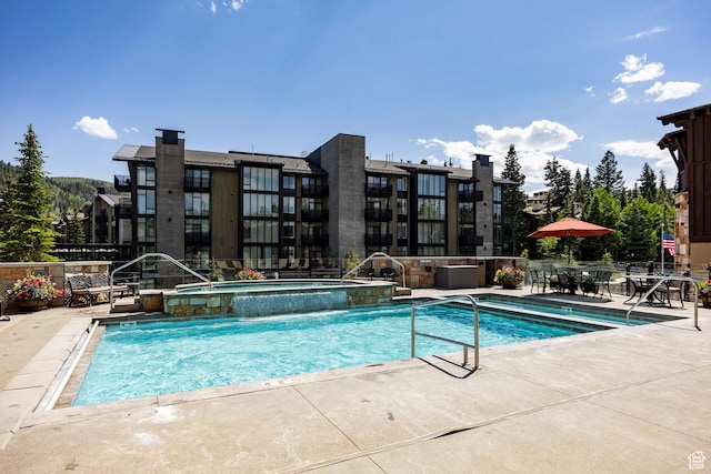 7815 Royal St Unit C259, Park City, UT 84060 - view of swimming pool featuring a patio area and a pool with connected hot tub