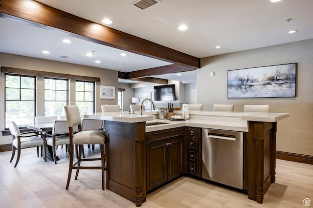 7815 Royal St Unit C259, Park City, UT 84060 - kitchen with stainless steel dishwasher, light countertops, light wood-style flooring, beamed ceiling, and recessed lighting