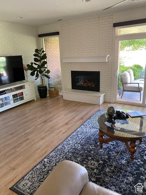 1014 W Bloomington Dr S, St George, UT 84790 - living area with wood finished floors and a brick fireplace