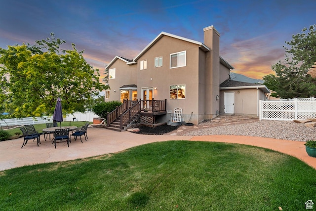 14012 S Osborne Ln E, Draper, UT 84020 - rear view of house with a patio, a chimney, a deck, and stucco siding