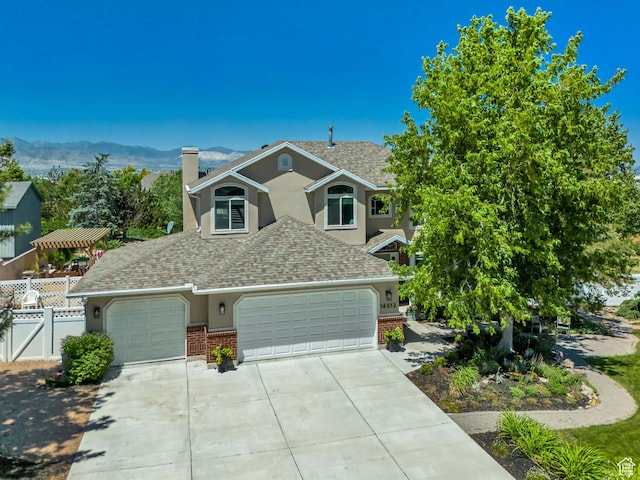 14012 S Osborne Ln E, Draper, UT 84020 - traditional-style house with brick siding, a shingled roof, a chimney, driveway, and stucco siding