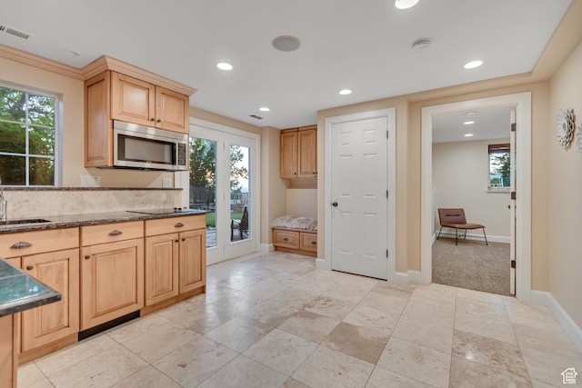 14012 S Osborne Ln E, Draper, UT 84020 - kitchen with stainless steel microwave, light brown cabinetry, recessed lighting, black electric cooktop, and dark stone countertops