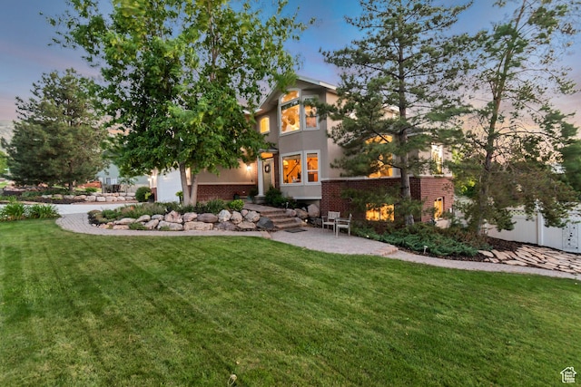 14012 S Osborne Ln E, Draper, UT 84020 - view of front of property featuring brick siding, stucco siding, and a garage